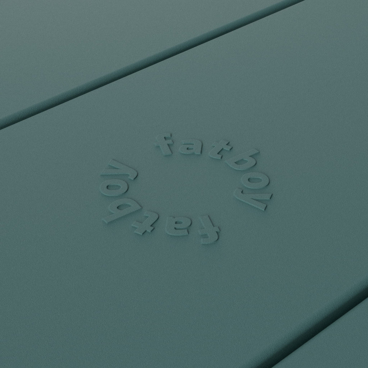 Close-up of Fred’s table by Fatboy in dark sage, showcasing its durable aluminum slats for a sleek and weather-resistant finish.
